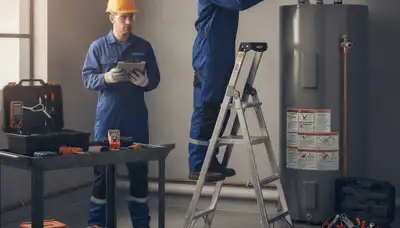 Atlanta plumber repairing a water heater for reliable hot water in Atlanta, GA